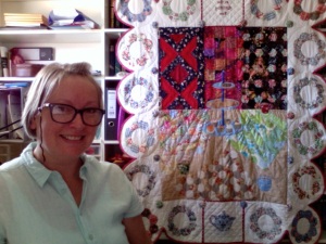 Smug self gloating in front of completed wall hanging