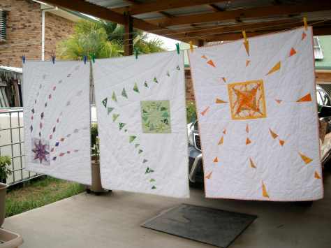 Three 'flying quilts' for my nephew's triplet baby daughters. Left is Komeet (Comet), centre is Vlucht (Flight) and right is Wervelwind (Whirlwind)